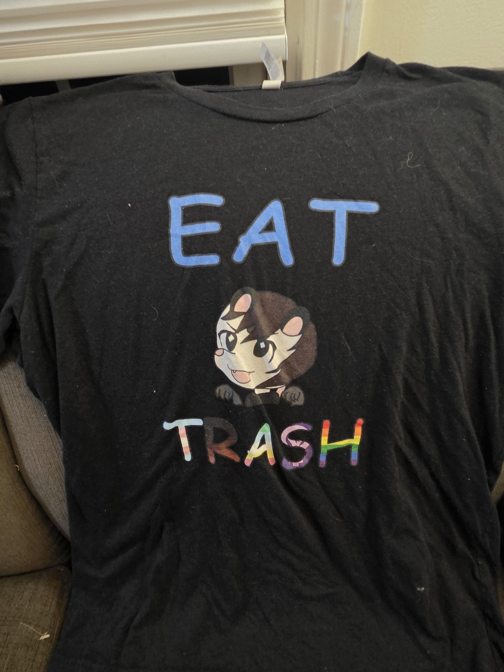 Bella Canvas Black Tee with Blue 'EAT' and Rainbow 'TRASH' Cat Graphic